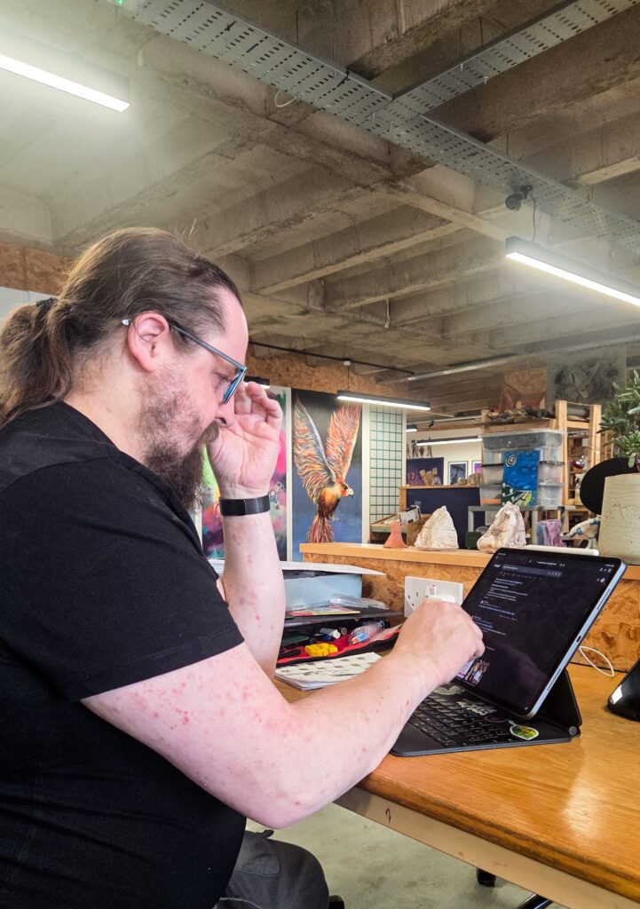 Thom working on a tablet
